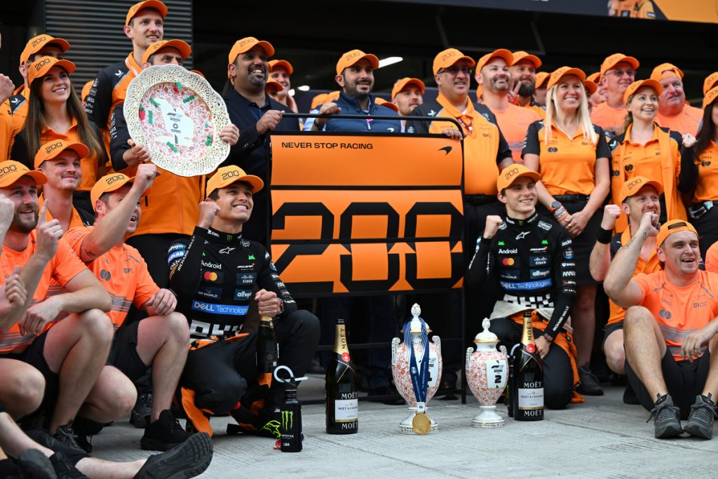 Lando Norris and Oscar Piastri celebrating McLaren 200th F1 victory at the 2025 Hungarian GP with a one-two finish.