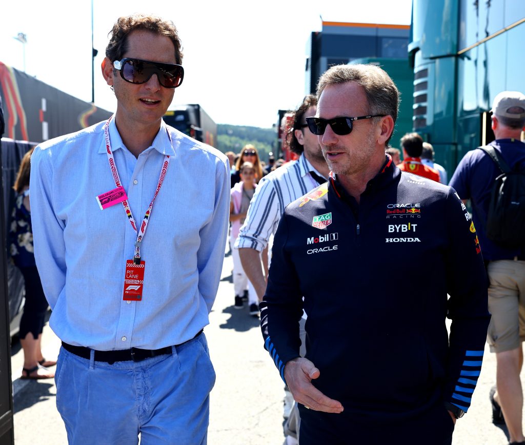 Christian Horner and John Elkann, Chairman and CEO of Ferrari walk in the Paddock prior to the F1 Grand Prix of Belgium at Circuit de Spa-Francorchamps on July 28, 2024 in Spa, Belgium