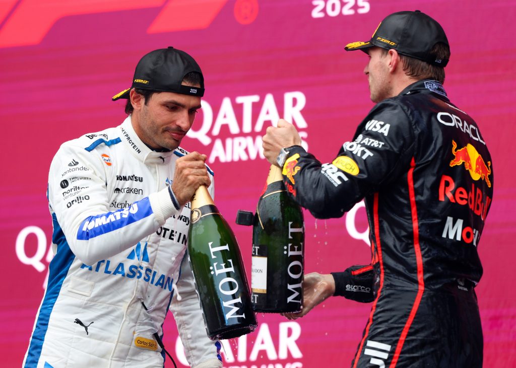 Race winner Max Verstappen of the Netherlands and Oracle Red Bull Racing and Third placed Carlos Sainz of Spain and Williams celebrate on the podium with Champagne during the F1 Grand Prix of Azerbaijan