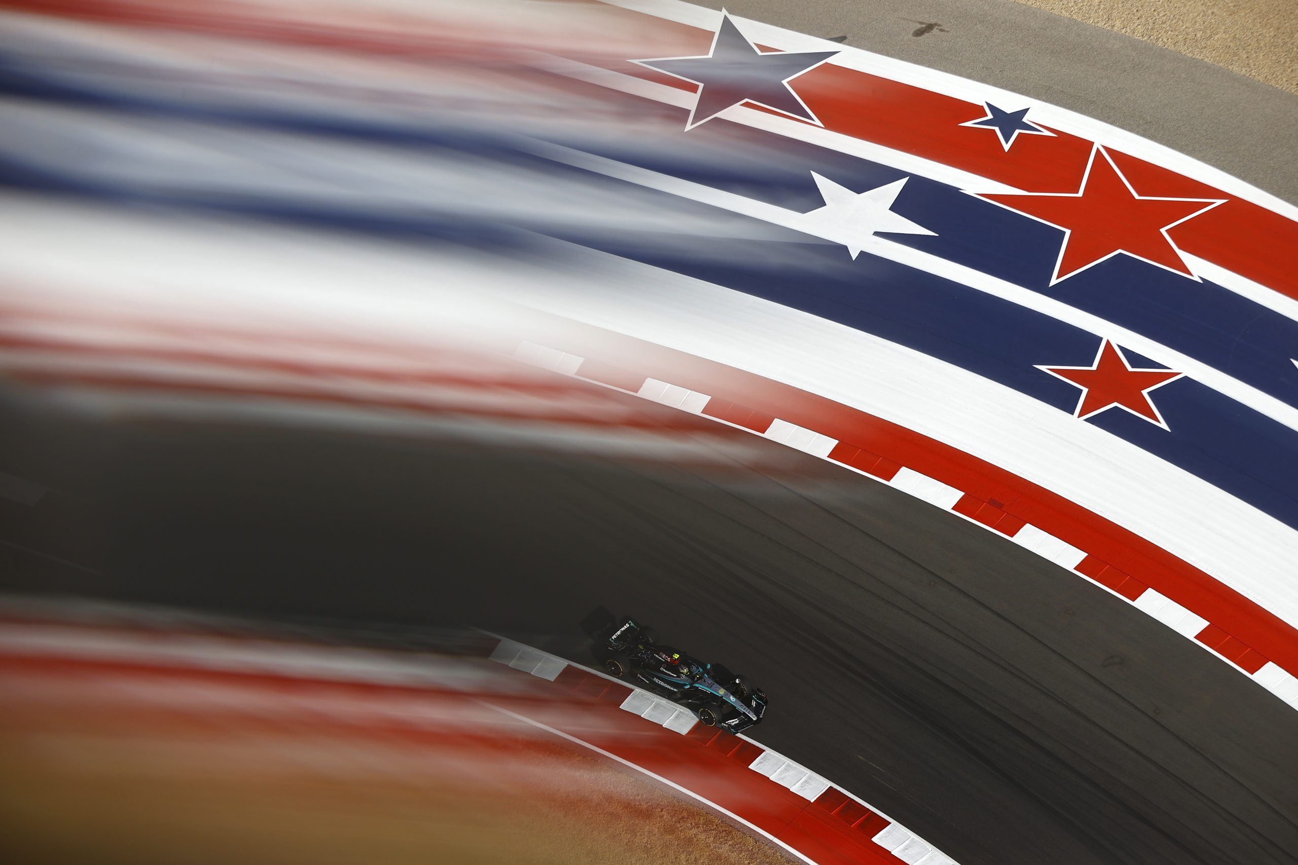 George Russell drives the Mercedes past COTA’s giant stars-and-stripes kerbs during practice at the USA GP 2024.