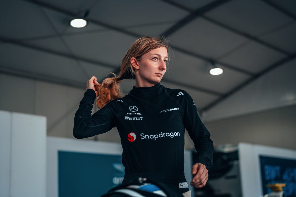 Mercedes F1 Academy driver Doriane Pin preparing in the garage during race weekend