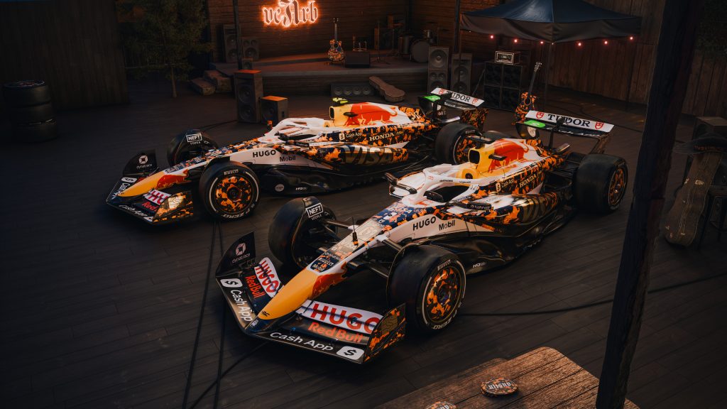 Red Bull Racing Bulls cars revealed in tortoiseshell-style livery under stage lights before the United States GP 2025.