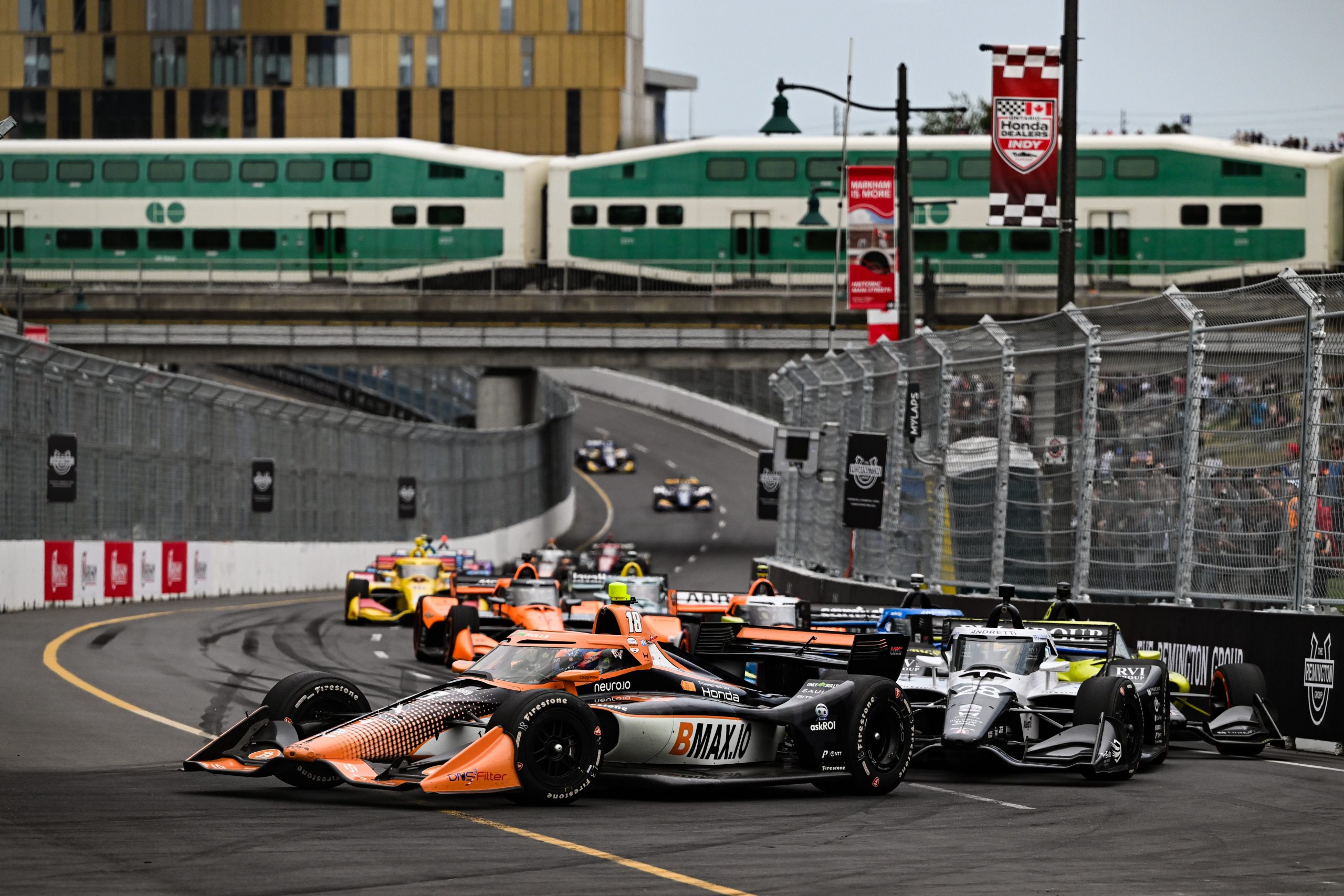 Romain Grosjean leading the grid through the new IndyCar Markham street circuit.